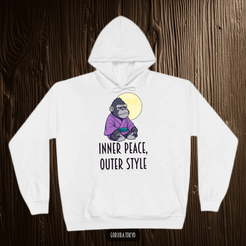 Comfortable hoodie featuring a funny gorilla in a purple kimono meditating under a stylized moon, bringing zen and humor.